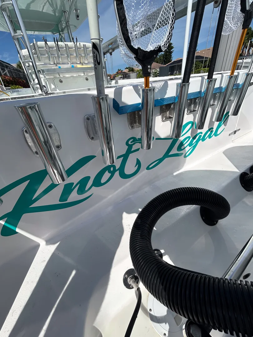 Knot Legal: Custom teal script boat lettering